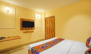 Voodi või voodid majutusasutuse FabHotel Shri Shubh Palace toas