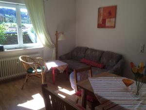 a living room with a couch and a table at Ferienhof Christmann in Mossautal