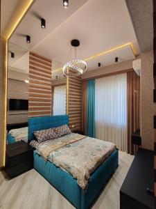 Postel nebo postele na pokoji v ubytování Tashkent City Apartments E2