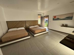 Postel nebo postele na pokoji v ubytování Onda Resort Pacifico