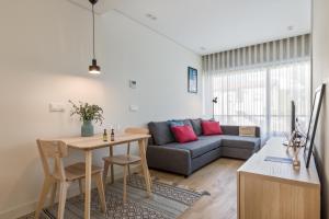 Et opholdsområde på Antas Park with pool and gym - to work & leisure