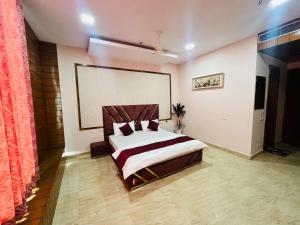 Postel nebo postele na pokoji v ubytování Hotel Agm