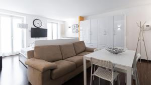 a living room with a couch and a table at Italianway - Torino 57 A in Milan