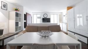 a living room with a table and a couch at Italianway - Torino 57 A in Milan