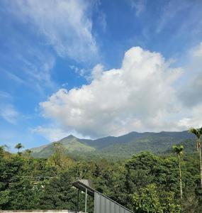 a view of the mountains from a house at Mount wave Pool villa in Wayanad +6 photos
