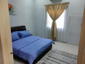 Postel nebo postele na pokoji v ubytování Kundang Villa @ Tasik Biru - 3 Bedrooms Bungalow