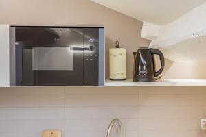 Kuchyň nebo kuchyňský kout v ubytování Corso Adriano 13 - Via Emilia