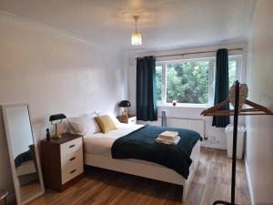 Postel nebo postele na pokoji v ubytování Greensfield Lodge