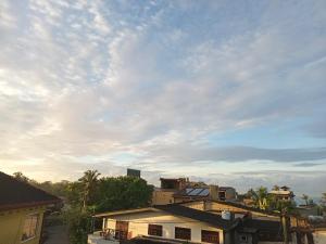 a view of a building with a cloudy sky at Ocean breeze in Galle