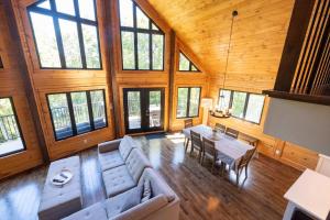 an overhead view of a living room with a couch and a table at Lakefront - Spa - Pool table - Mistral 154 in Sainte-Marguerite