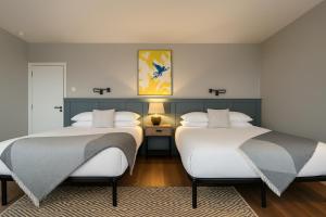 two beds sitting in a room with at Onyx House in Blackpool