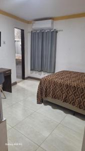 Postel nebo postele na pokoji v ubytování quarto 04