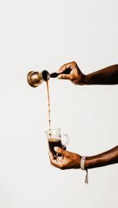 two hands holding a cup with a drink at Gabila Blue Lagoon in Dahab +18 photos