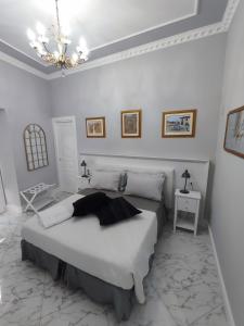 Postel nebo postele na pokoji v ubytování Le Nouveau Grand Tour - Dimora del Commendatore