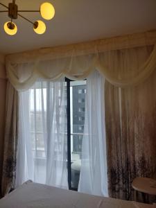 Postel nebo postele na pokoji v ubytování Lenayan at Artesano + 26 fotografií