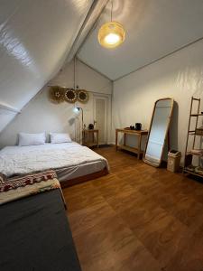 a bedroom with a bed in a tent at D'River Luxcamp in Cisarua