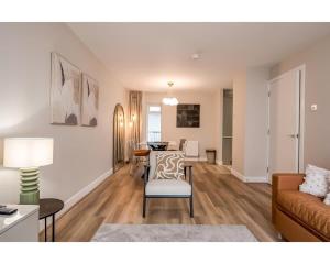 a living room with a couch and a table at Central Belfast Apartments: Citygate in Belfast +101 photos