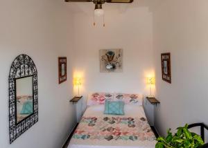 a bedroom with a bed and a mirror at Stunning 18th century cortijo with 2 private pools sleeps 12 in Vera +36 photos