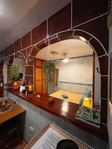 a kitchen with a counter with an arch in the wall at Apartamentos San Jose in Valle Gran Rey +73 photos