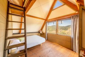 Postel nebo postele na pokoji v ubytování Il Castagno Toscana Glamping + 23 fotografií