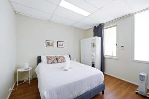 Postel nebo postele na pokoji v ubytování Chadstone Holiday W2 Villa