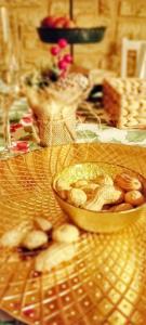 a wooden table with a bowl of food on it at ALLA CASCATA in centro Branzi self check-in parcheggio gratuito coperto in Branzi