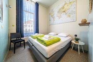 Postel nebo postele na pokoji v ubytování Auberge de Jeunesse de Tournai - Youth Hostel