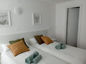 Ένα ή περισσότερα κρεβάτια σε δωμάτιο στο Habitaciones Algodón con baño propio