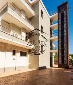 a building with a sign on the side of it at Il Nido dei Merli in Fiumicino