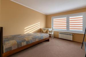 Postel nebo postele na pokoji v ubytování Parking-pokój, WiFi