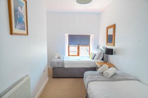 Voodi või voodid majutusasutuse Finest Retreats - Rosemary Cottage toas