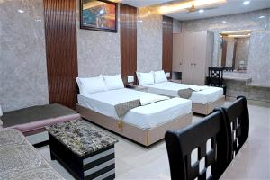 Un pat sau paturi într-o cameră la GM hotel +35 fotografii