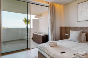a bedroom with a bed and a view of the ocean at Palo Alto 9 Panoramic Views Terrace Luxury in Monda