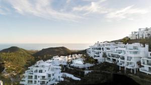 a group of white buildings on top of a hill at Palo Alto 9 Panoramic Views Terrace Luxury in Monda