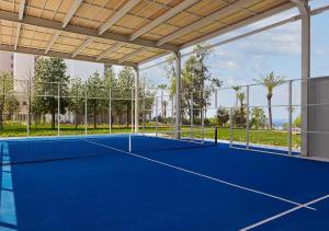 an image of a tennis court in a building at Akra Antalya in Antalya