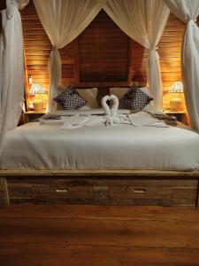 Postel nebo postele na pokoji v ubytování Arta dani villas