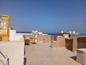 a view of the beach from the roof of a building at Essa Apartment in Safaga 