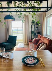 a dining room table with a plate of food on it at Colorado in Gdańsk