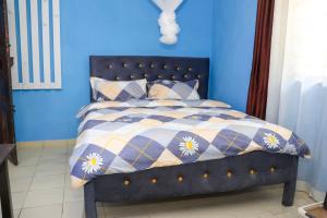 Postel nebo postele na pokoji v ubytování Mtwapa Empire Holiday Apartments + 14 fotografií