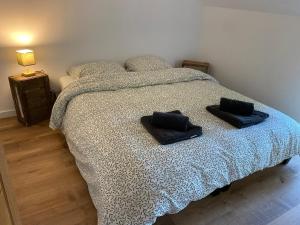 Postel nebo postele na pokoji v ubytování Le fournil