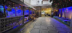 a hallway of a building with purple and blue lights at Hotel Sunshine Airport in Mumbai