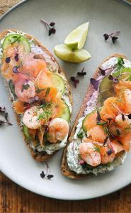 two slices of bread with shrimp and vegetables on a plate at 1Bd Apt City Centre Contractor Friendly in Wolverhampton