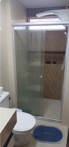 a glass shower in a bathroom with a toilet at Maison Chateaubriand Residence in Maceió