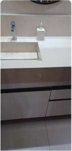 a white counter top with a sink in a room at Maison Chateaubriand Residence in Maceió +6 photos