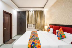 Ένα ή περισσότερα κρεβάτια σε δωμάτιο στο FabHotel Novis House