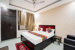 Ένα ή περισσότερα κρεβάτια σε δωμάτιο στο FabHotel Novis House