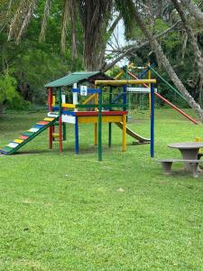 a park with a playground with a slide at Eden Wilds 42 in Port Edward