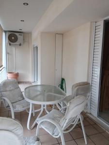 a white table and chairs in a room at Stylish Luxury 3 Bd Penthouse in Drosia Center in Drosia
