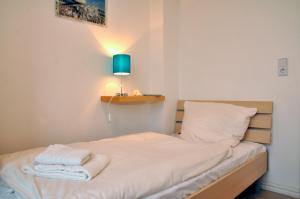 Voodi või voodid majutusasutuse NordseeResort Friesland NordseeResort Friesland 3 toas