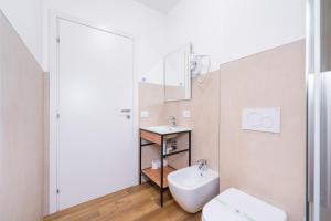 a bathroom with a toilet and a sink at Residenza Campofiore in Verona +52 photos